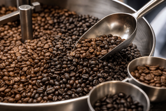 Roasted coffee beans from different coffees mixed together on a table